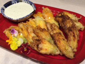 Squash blossoms - filled with shrimp or herb cheese, served with a cilantro serrano cream